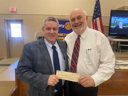 Dr. Griffin presenting Bob Patterson with an $800 check for the DORCUS Food Ministery .jpg