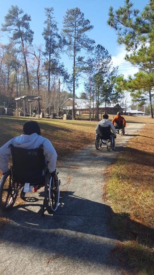 Students in PARC Program riding in wheelchairs.jpg