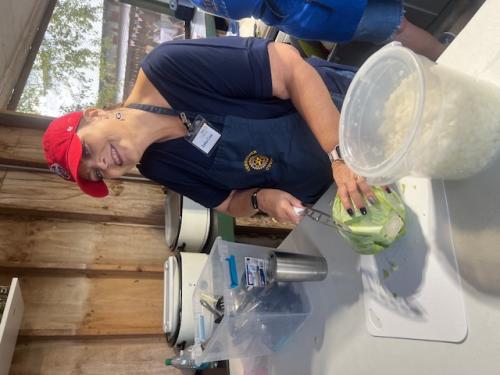 Deanne Crews cutting Cabbage for slaw.jpg