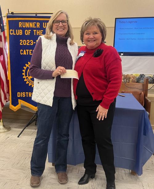 Beth Hadley holding donation from the Rotary Club with Dawn Woodard.jpg