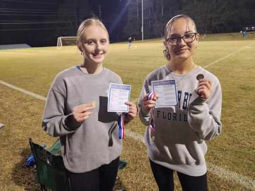 Students receive the Rotary 4 way test and the Rotary Coin after the Soccer season.JPG