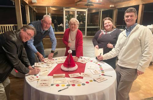 Group signing Christmas cards for Residents in Asst Living in North Carolina.jpg