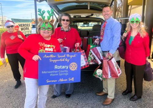 Rotary and Woman's Club members delivering gifts.jpg