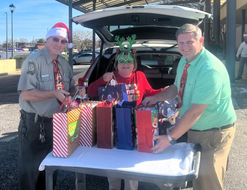 Jason, Dawn and Allen unloading gifts for Nursing Home residents.jpg