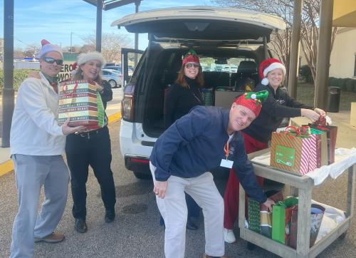 Group unpacking gifts and putting on cart at nursing home.jpg