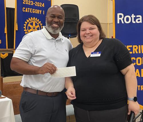 President Melissa Trujillo presents check to the PARC program to Quardez Warrior 2025.jpg
