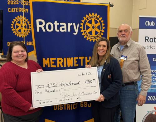 President Melissa Trujillo presents Kay Williamson, & Bob Patterson, rotary grant check of 7000.jpg