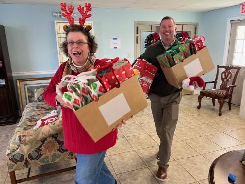Cynthia Kilby and Bart Fuller caring gifts for Santa for Seniors.jpeg