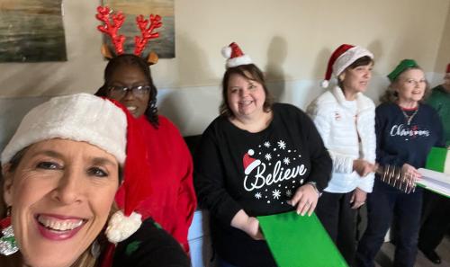 Kay, Stephanie, Melissa, Sheri Jo and Pat singing Christmas Carrols to Seniors.jpeg