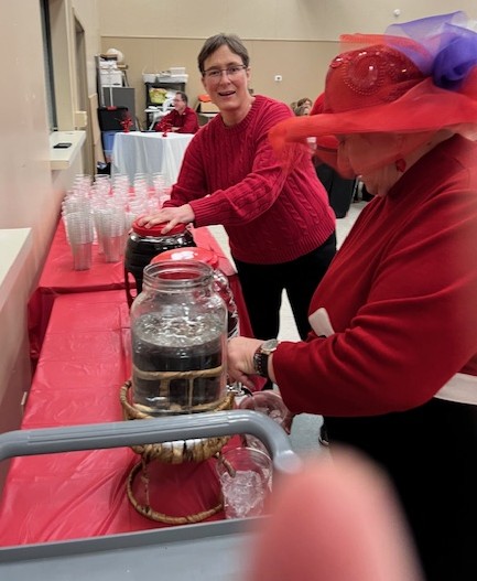 Louanne and Virginia serving drinks.jpeg
